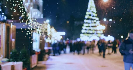 defocused crowded christmas fair at the city square in beautiful snowy night - Powered by Adobe