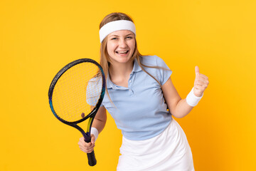 Teenager Ukrainian girl tennis player isolated on yellow background