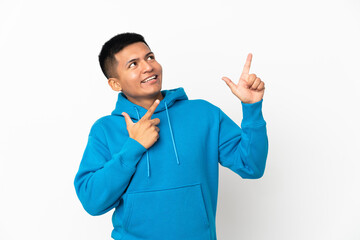 Young Ecuadorian man isolated on white background pointing with the index finger a great idea