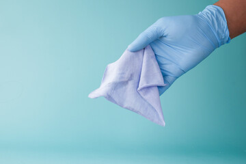 close up of person hand cleaning table with cloth 