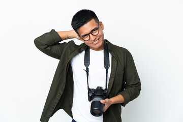 Young Ecuadorian photographer isolated on white background laughing