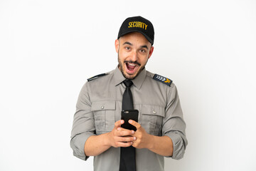 Young security  caucasian man isolated on white background surprised and sending a message