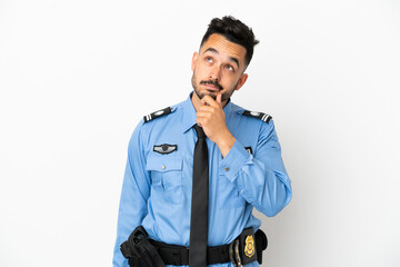 Fototapeta premium Police caucasian man isolated on white background having doubts and thinking