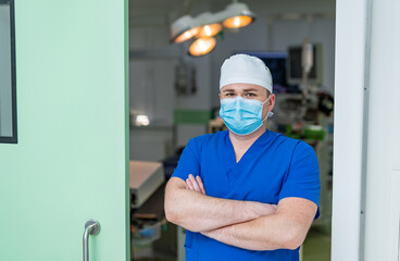 Fototapeta na wymiar Medical specialist in mask in modern hospital. Professional doctor in unform.