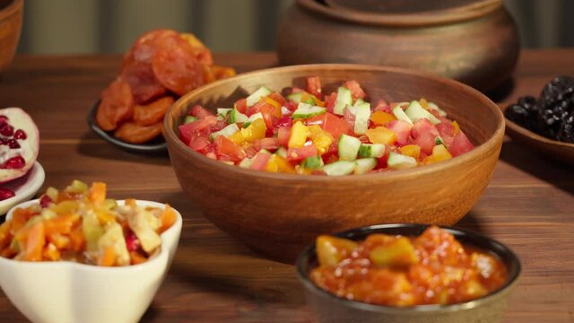 Moroccan cuisine. Traditional dishes, vegetable salad. Middle eastern culture. Homemade food. Bowls with sauces and cold appetizer.