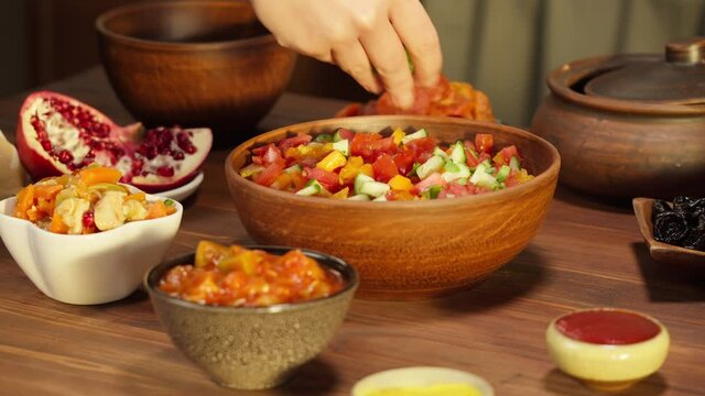 Moroccan cuisine. Traditional dishes, vegetable salad. Middle eastern culture. Homemade food. Bowls with sauces and cold appetizer.