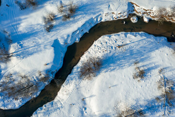 Drone shot flying on winter river