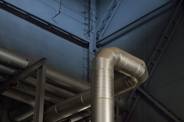 Large industrial boiler room, new shiny pipes close-up. Central heating station. Industry,...