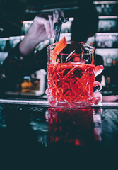 woman hand bartender making cocktail in bar