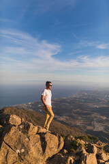 General view of a young man on top of Sierra Bermeja mountain, Malaga