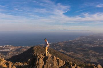 General view of a young man on top of Sierra Bermeja mountain, Malaga