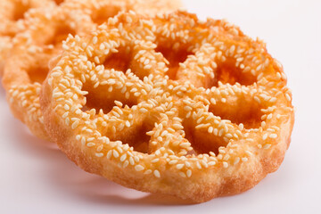 Shaking flower (kembang goyang) cake traditional from indonesia,Made from flour, sugar, milk, and baking powder.cake on white background 
