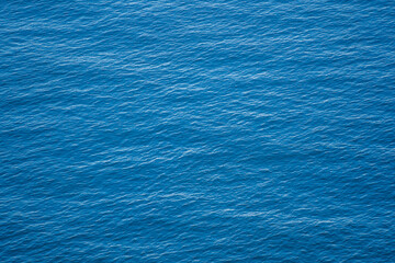 Blue sea water surface with waves, top view - obrazy, fototapety, plakaty