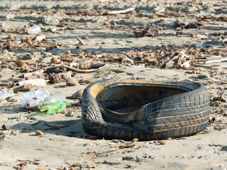 Tire, plastic bottles and other garbage symbol of serious pollution - 477752797