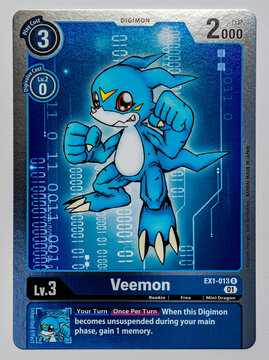 Hamburg, Germany - 12252021: top shot photo of the English Digimon trading game card Veemon from the Classic Collection EX01 series.