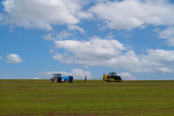 Fototapeta premium tractor plows the field to sow new crops