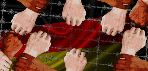 The hands of people of different nationalities and skin colors hold each other's wrists against the background of the germany flag with barbed wire. Tolerance. Fight against razism. BLM.