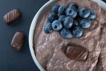 Traditional Finnish foods: Overhead shot of a bowl of chocolate porridge with blueberry topping
