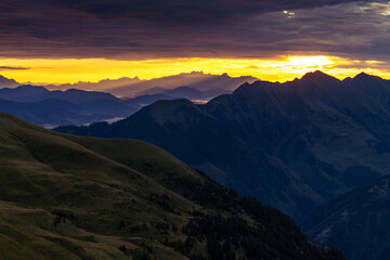 Epic sunrise above the rocky peaks of Austrian Alps in the early morning from Gleiwitzer Hutte. Sunrise in High Tauern. Dawn in the mountains. Glocknerrunde trail.