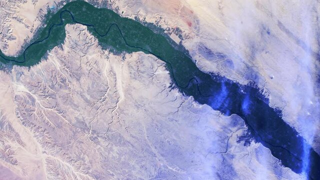 Green fertile land along course of Nile river Egypt, Africa agriculture aerial satellite view from space sunrise animation. Based on image furnished by Nasa