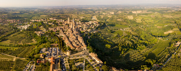 Aerial/Drone panorama of San Gimignano in the tuscany and its vineyards and olive trees, Tuscany Italy	