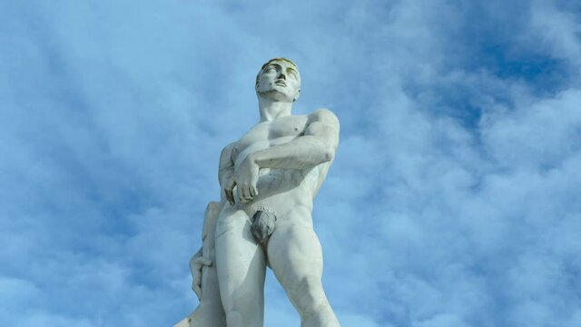 Time lapse of athlete statue, hero with moving clouds, Stadio dei Marmi (Stadium of the Marbles), Roma, Italy