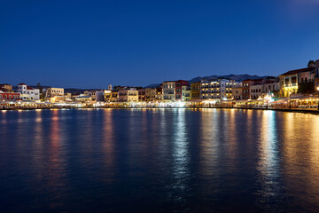 Fototapeta premium Taverns and houses in the evening in the port of Chania town