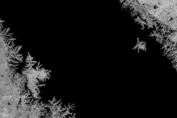 Frosty frame. Decorative ice crystals frame on black matte background