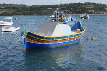 Naklejka na ściany i meble colorful fishing boat in marsalokk