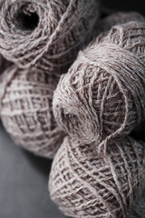 Light brown wool yarn made of threads in tangles.