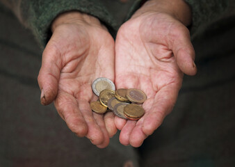 Hard working woman hands giving change in euro coins