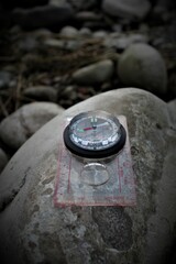 A compass on a stone.

