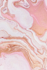 Abstract background in pink and orange with marble texture from closeup of acrylic pour art