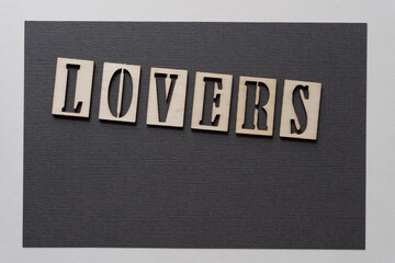 the word "lovers" isolated on paper