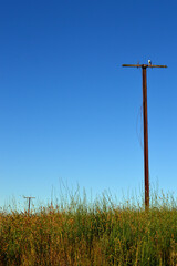 Fototapeta na wymiar A power pole in disrepair