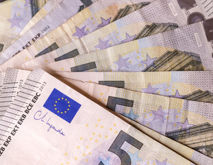 Fototapeta Close up of numerous euro banknotes lying on top of each other. obraz