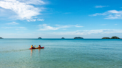 Fototapeta na wymiar Kayakers on a blue ocean in tropical Thailand
