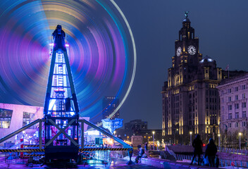 Long Exposure of fun fair ride in front of the Liver Building during the Pier Head Ice Festival