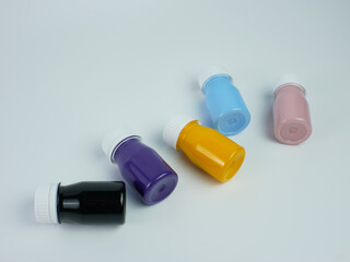 pigment resin paint in the bottle, many colors there are purple, pink, blue, orange, and black.
