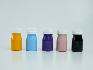 pigment resin paint in the bottle, many colors there are purple, pink, blue, orange, and black.