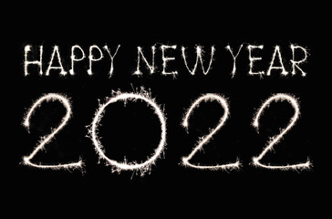 Happy New Year 2022 text hand written sparkles fireworks.
