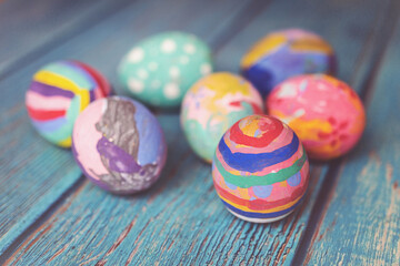 Colorful Easter eggs on table. Easter festive holidays concept.