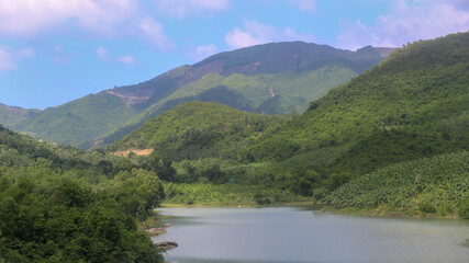 Obraz na płótnie Canvas The view of Kenh Ha Lake and mountains in Nha Trang City, Khanh Hoa province