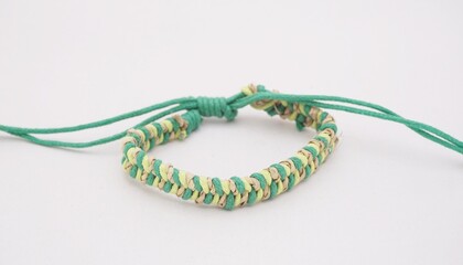 An isolated ethnic bracelet on white background. The bracelet is made off the various rope
