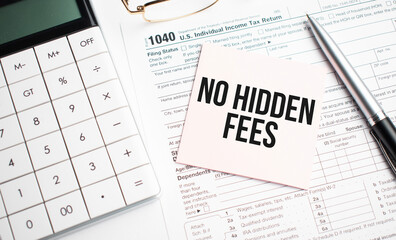 NO HIDDEN FEES with pen, calculator, glass and sticker. Tax report sign