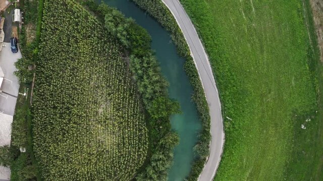Drone footage of a river, road and nature