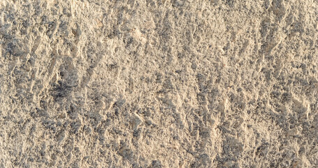 Natural beige stone as a background or texture seamless for design