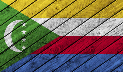 Comoros flag on wooden background. 3D image