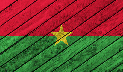 Burkina Faso flag on wooden background. 3D image