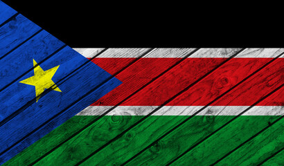 Southern Sudan flag on wooden background. 3D image